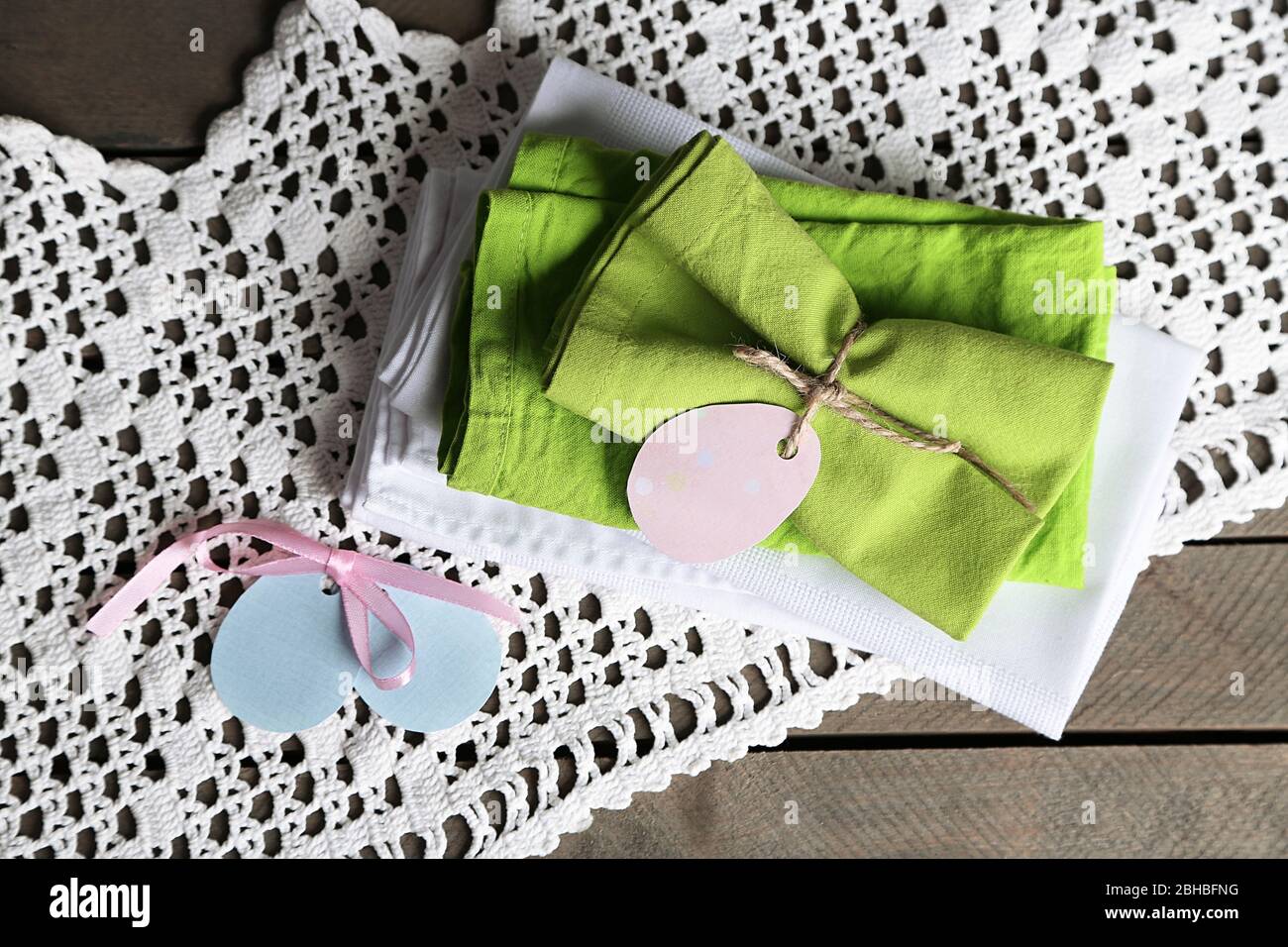 Napkins with Easter decorations  on wooden background Stock Photo
