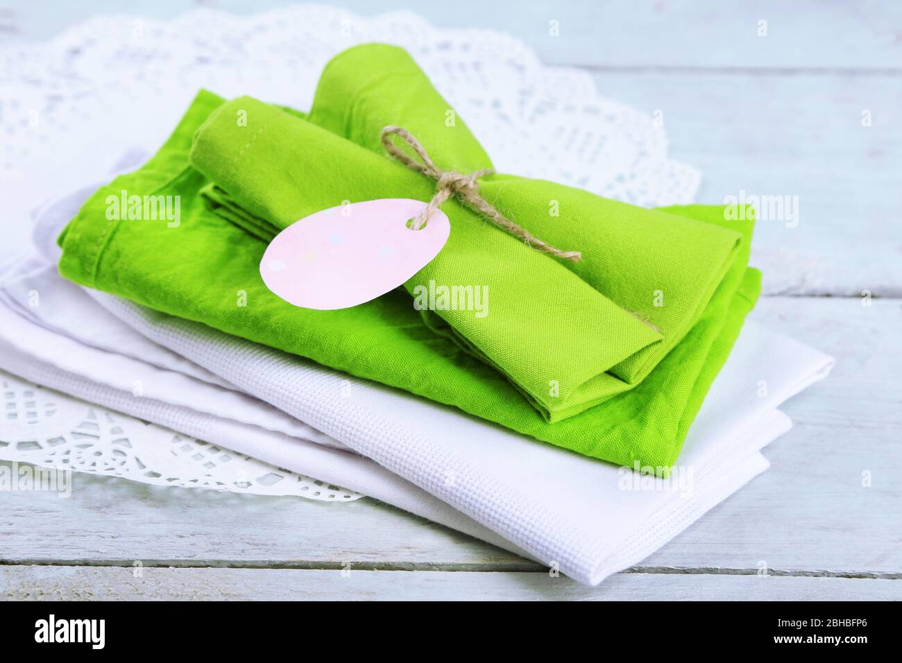 Napkins with Easter decorations  on wooden background Stock Photo