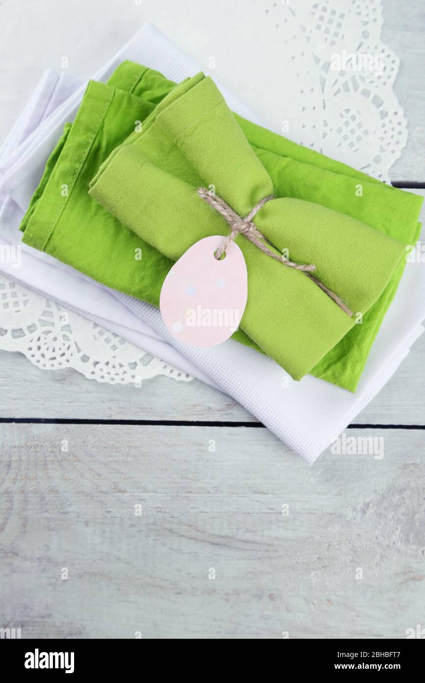 Napkins with Easter decorations  on wooden background Stock Photo