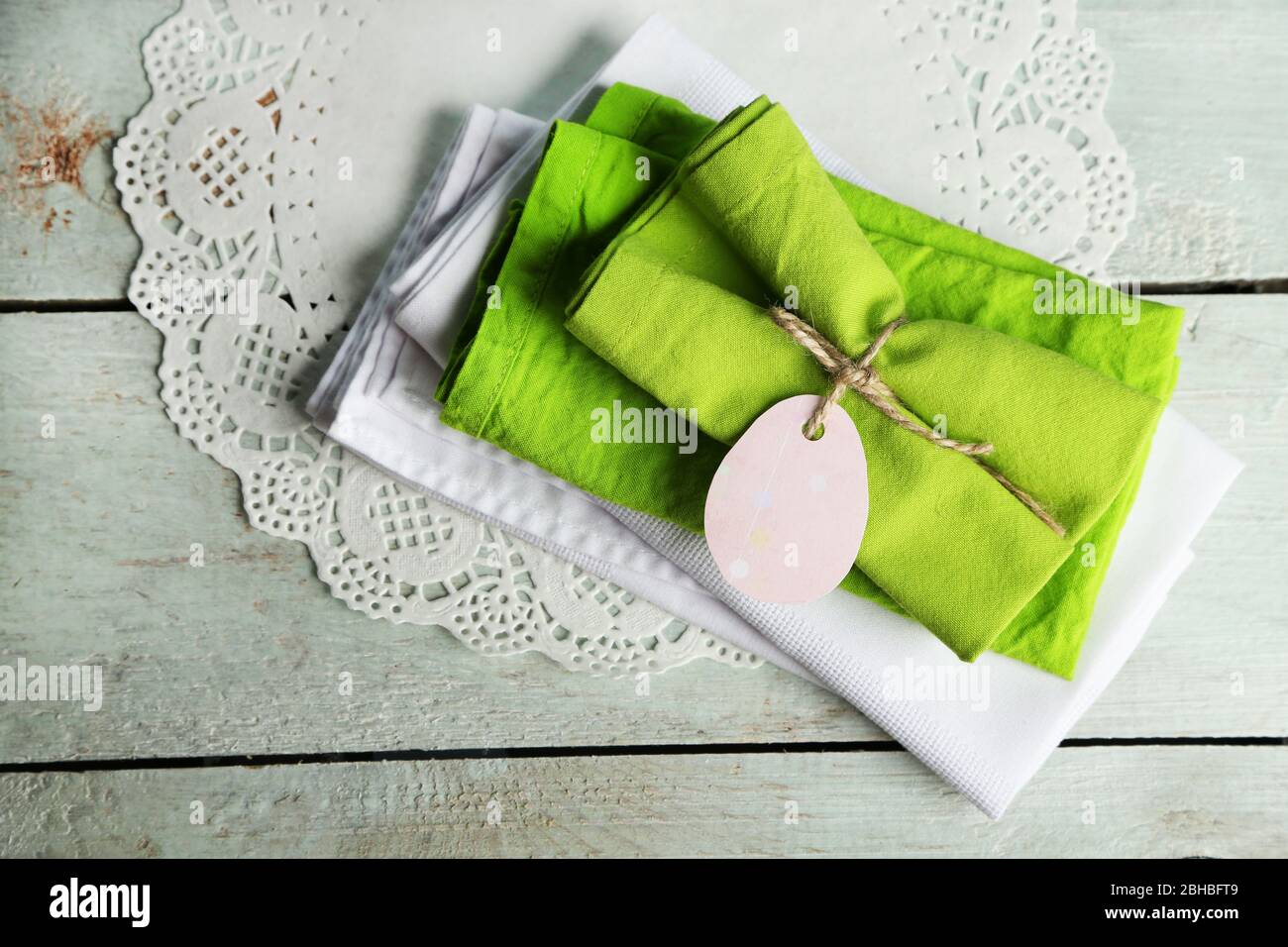 Napkins with Easter decorations  on wooden background Stock Photo