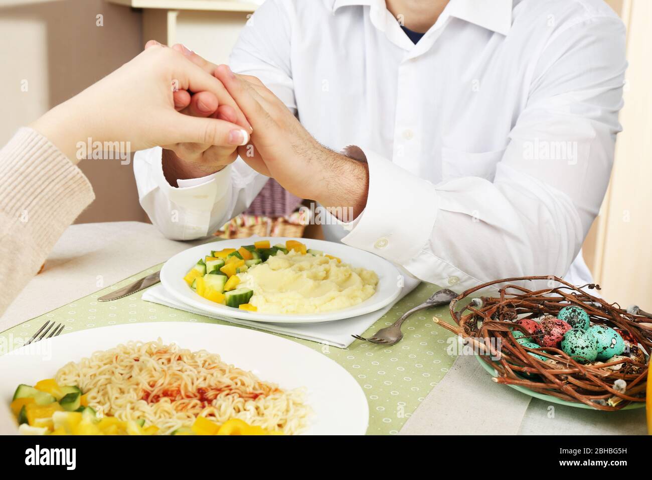 People praying before eating Stock Photo Alamy