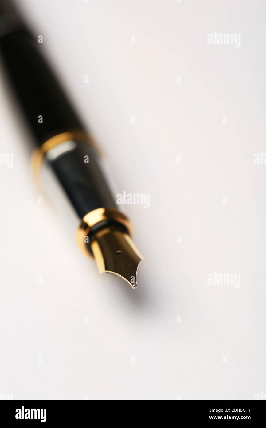 Fountain pen on white sheet of paper background Stock Photo - Alamy