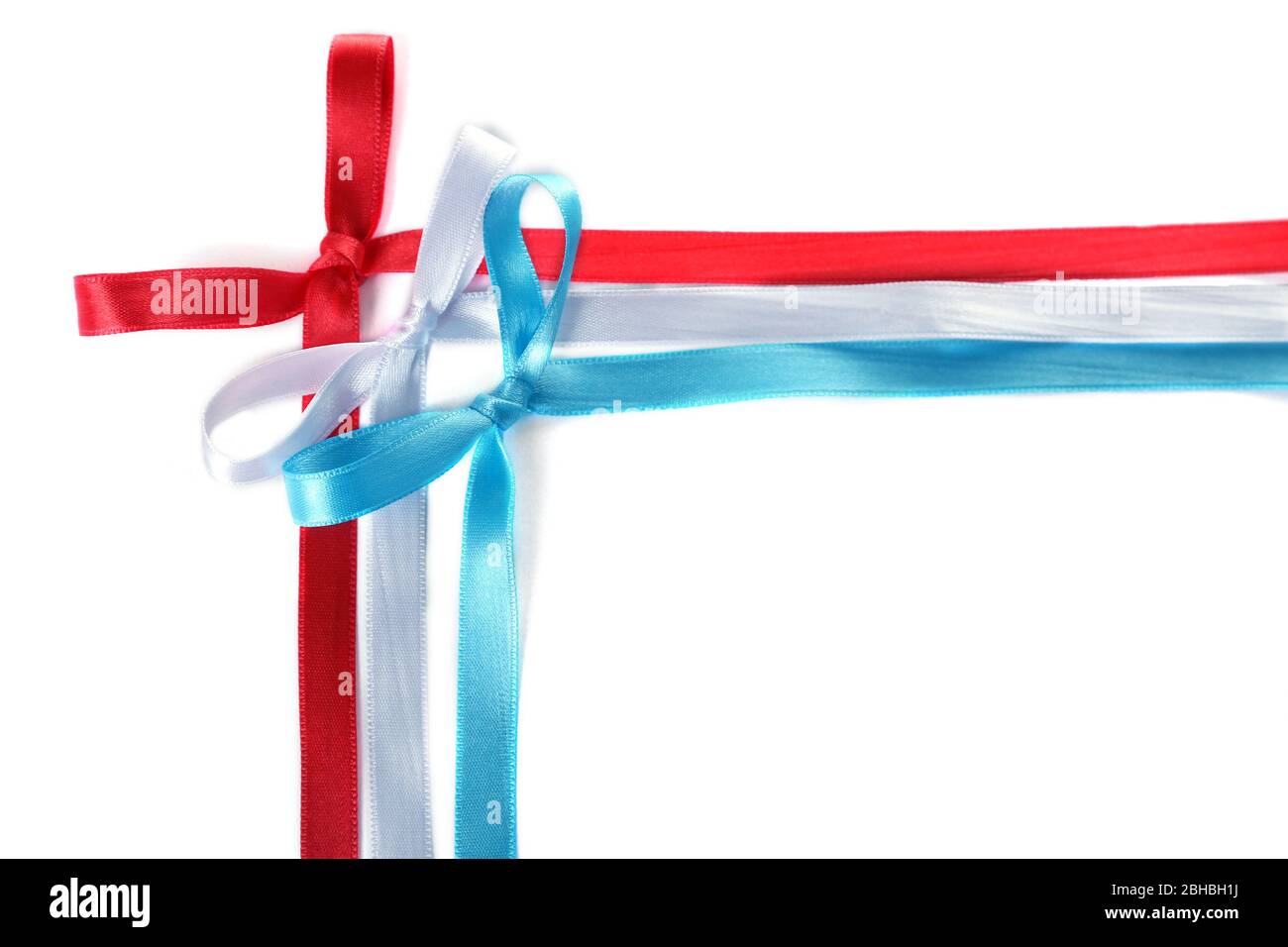 Frame of colorful ribbons with bow isolated on white Stock Photo - Alamy