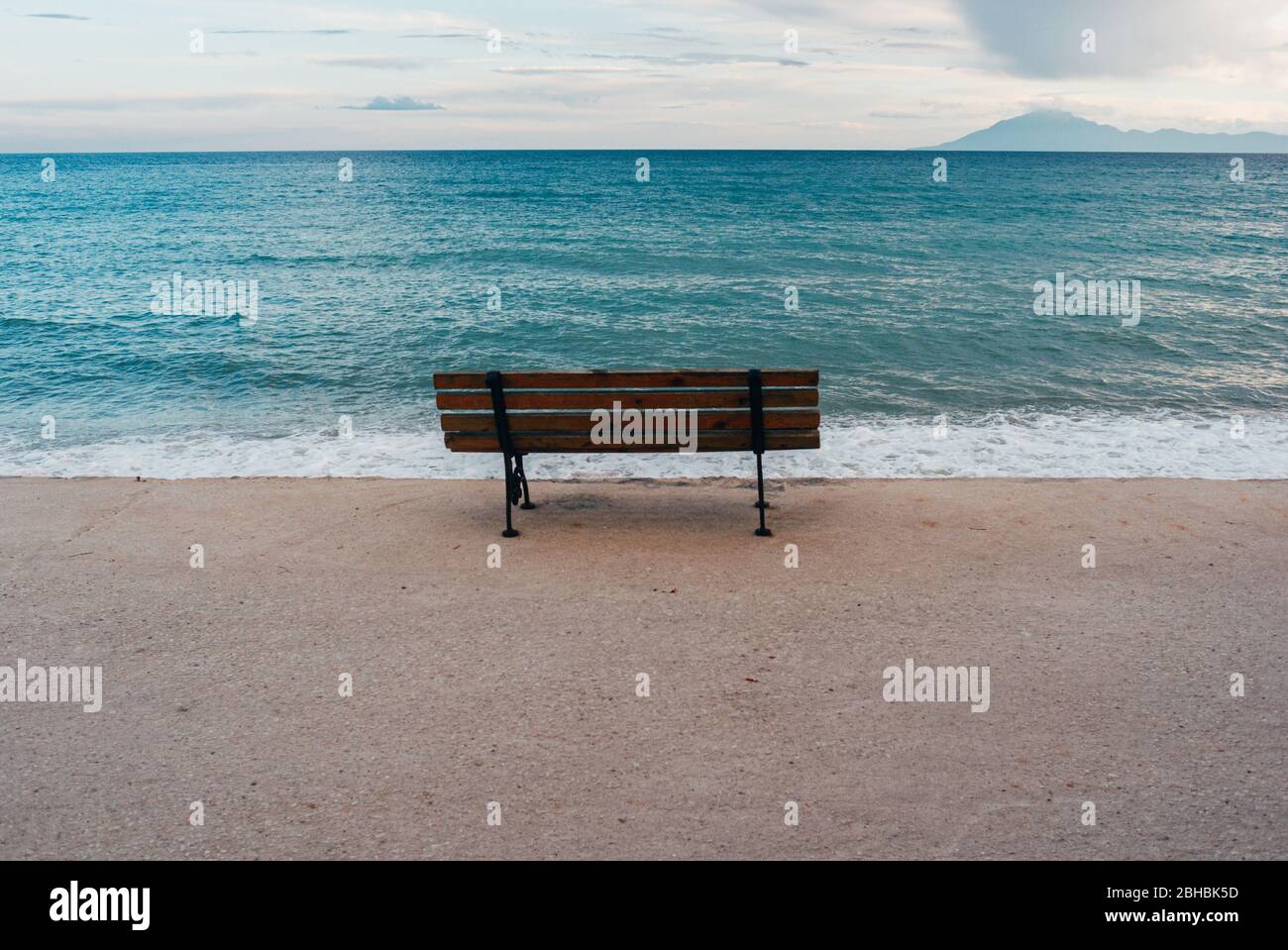 Empty wooden bench. Concept of absence, emptiness and tranquility Stock Photo