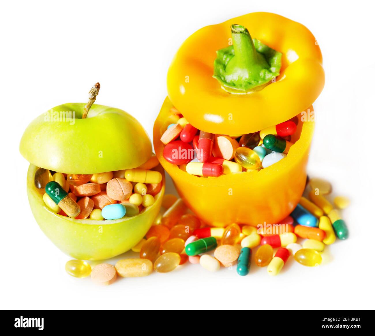 Apple, paprika and colorful pills, on light background Stock Photo Alamy