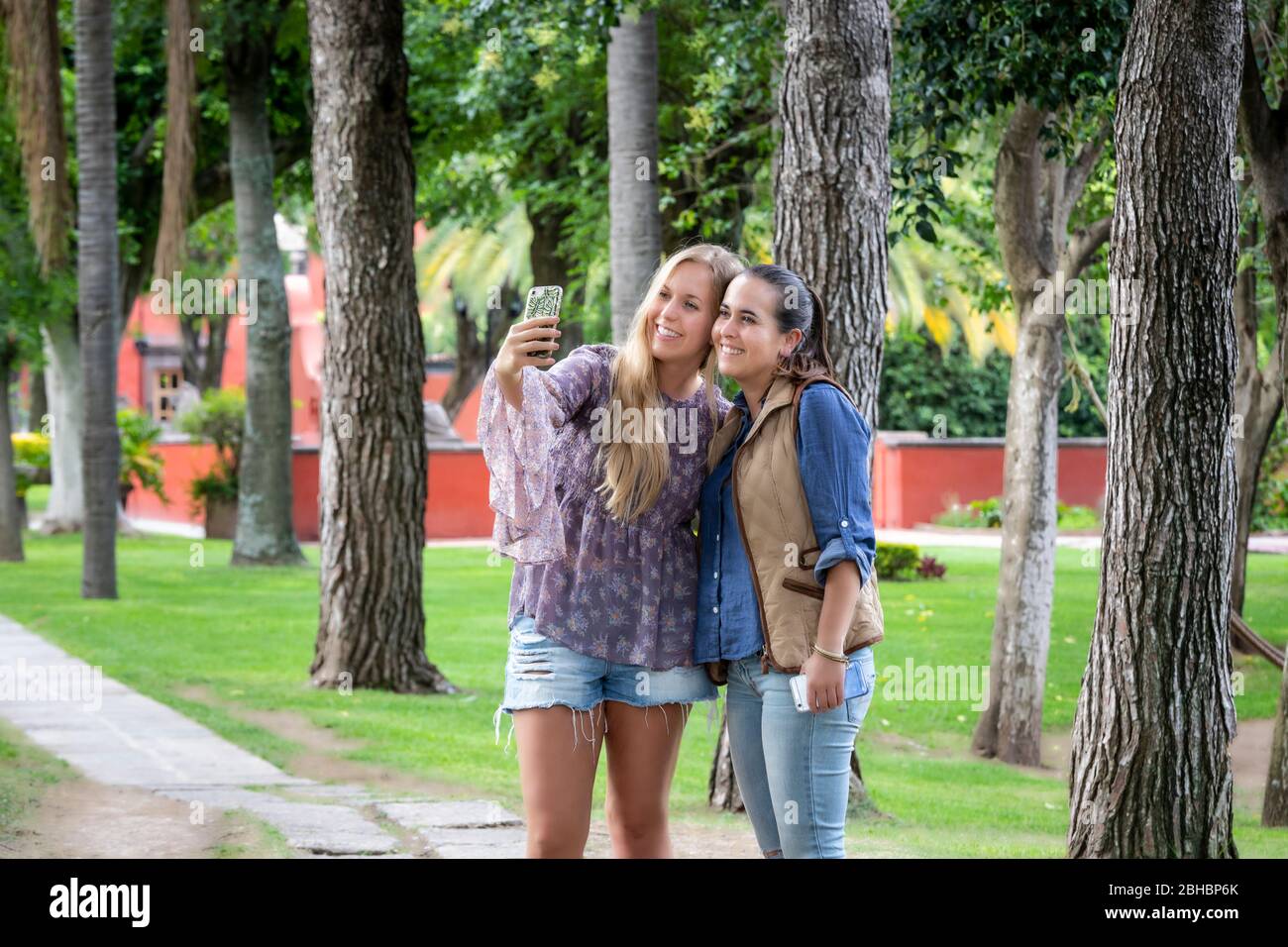 Sisters take a selfie at a colonial hacienda in Queretaro, Mexico. Stock Photo