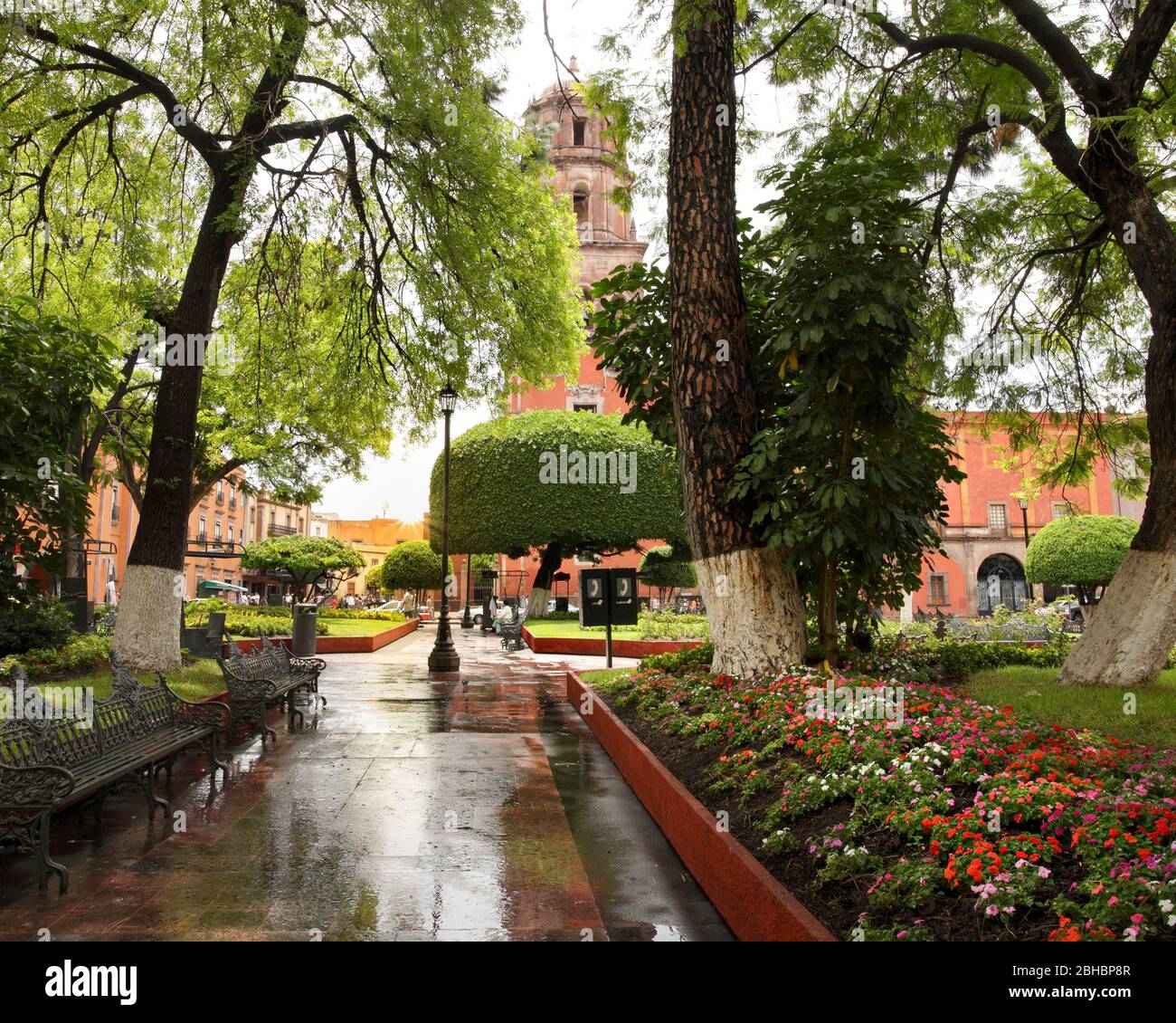 The sun peeks out after a rainy afternoon in the main plaza of Queretaro, Mexico. Stock Photo