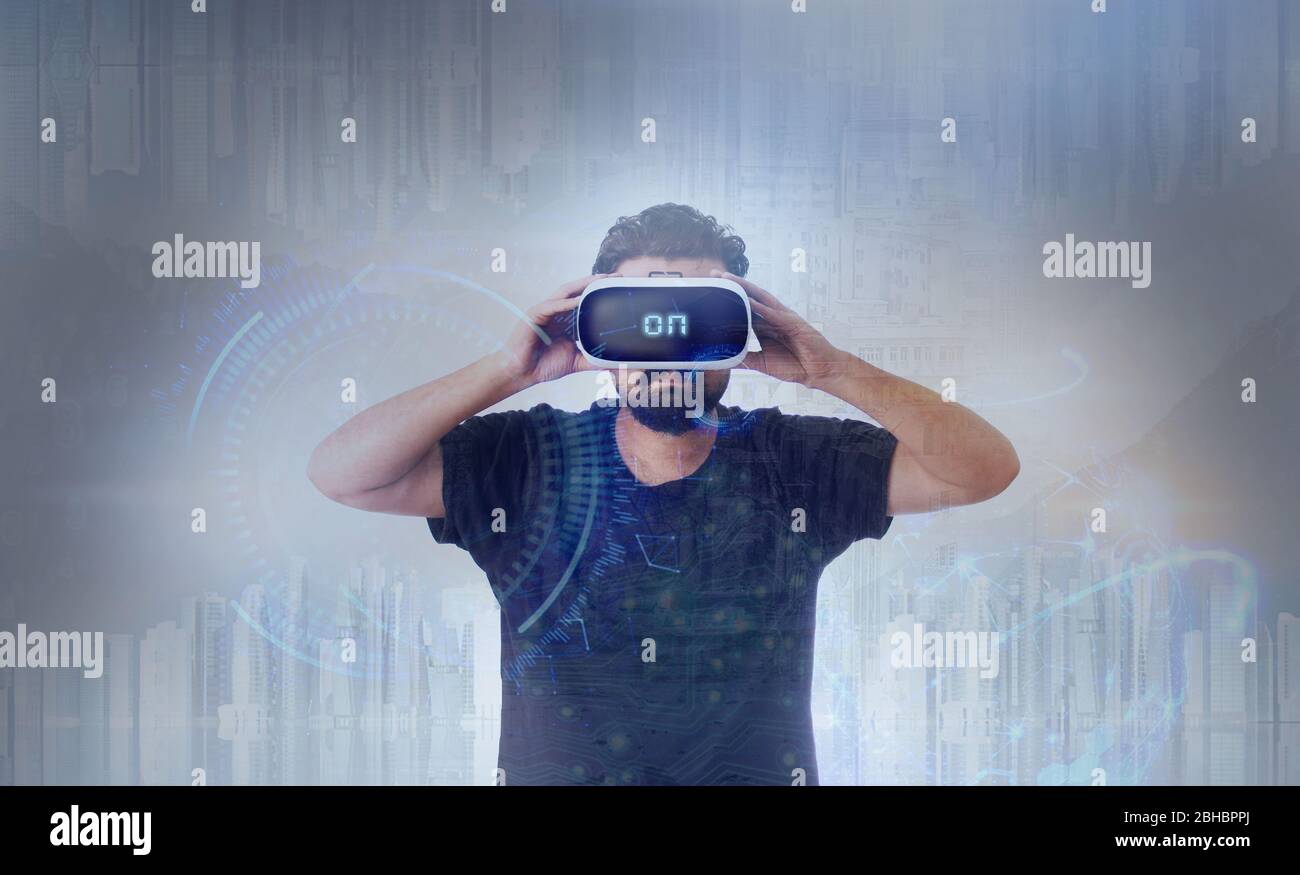 Young Guy in black t shirt wearing VR Virtual Reality glasses - Word On Stock Photo