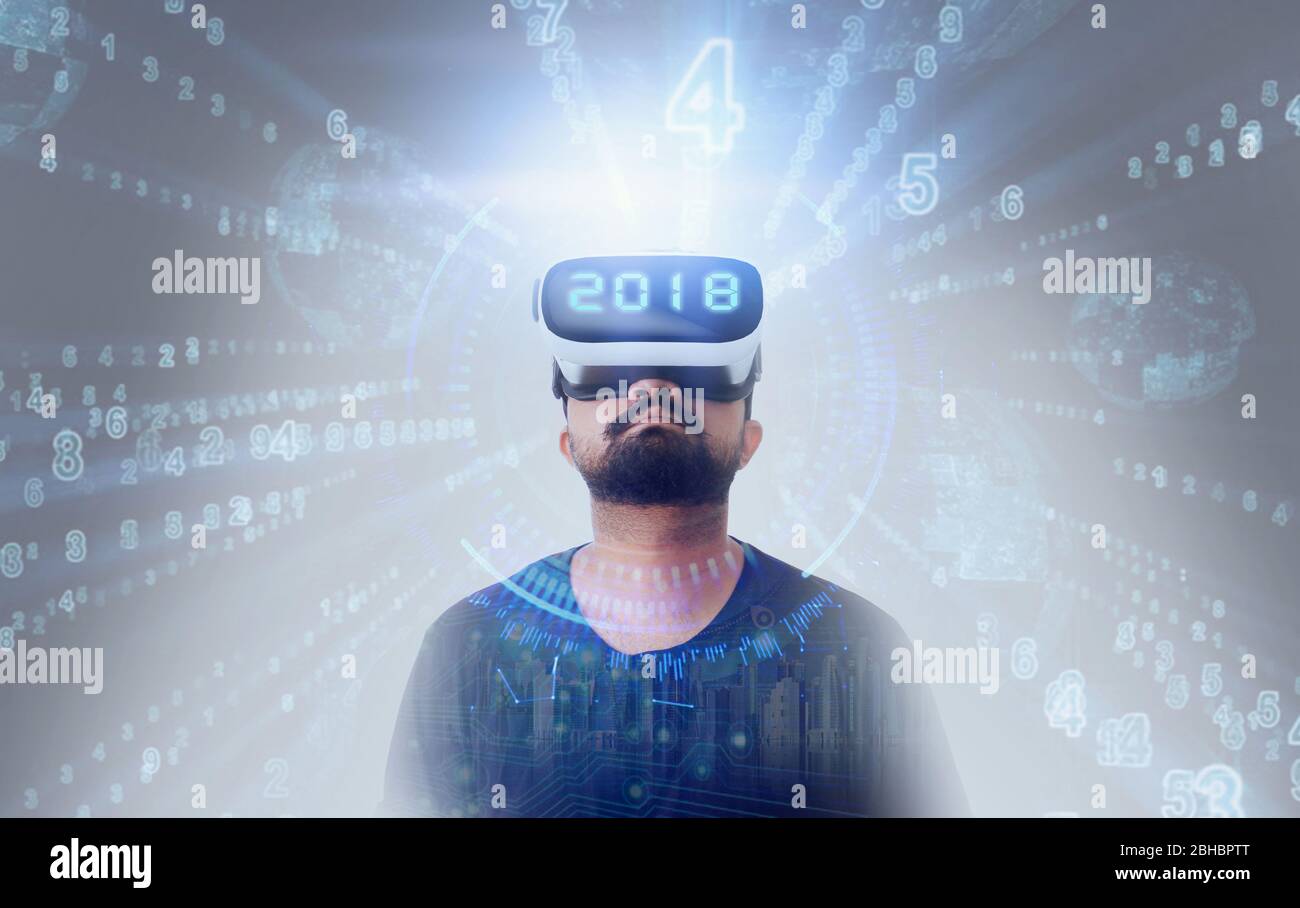 Young Guy in black t shirt wearing VR Virtual Reality glasses - 2018 Stock Photo