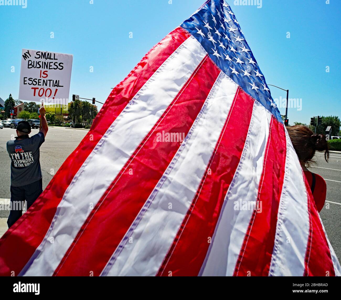 OpenUpCA  Sants Ana, California, 24th of April, 2020, protesters rallying around the outskirts of Santa Ana, waving american flags demanding reopen california, go to work. Stock Photo
