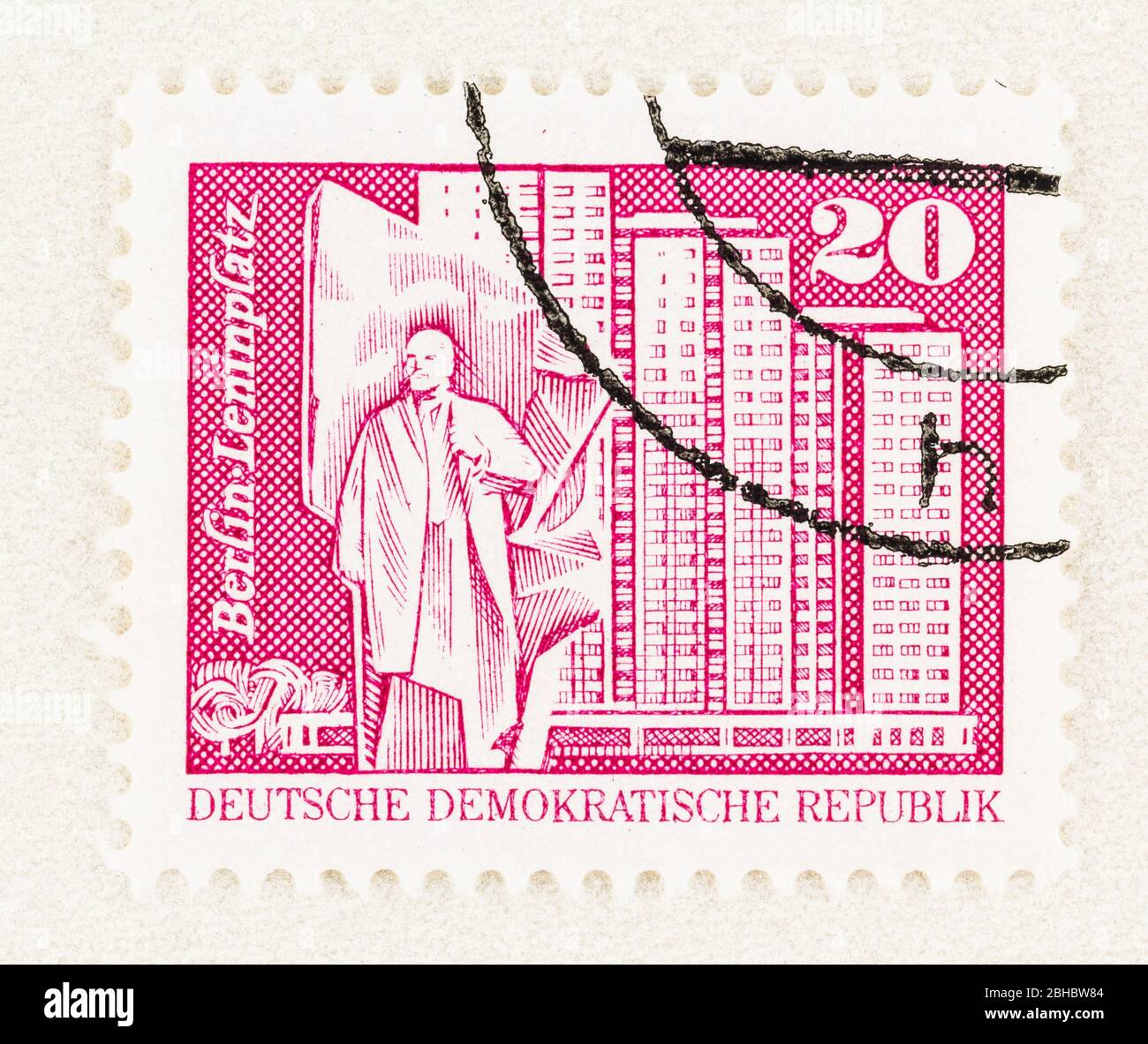 SEATTLE WASHINGTON - April 23, 2020: 1980 East German Stamp featuring a Berlin Leninplatz with statue and residential towers. Small format Stock Photo
