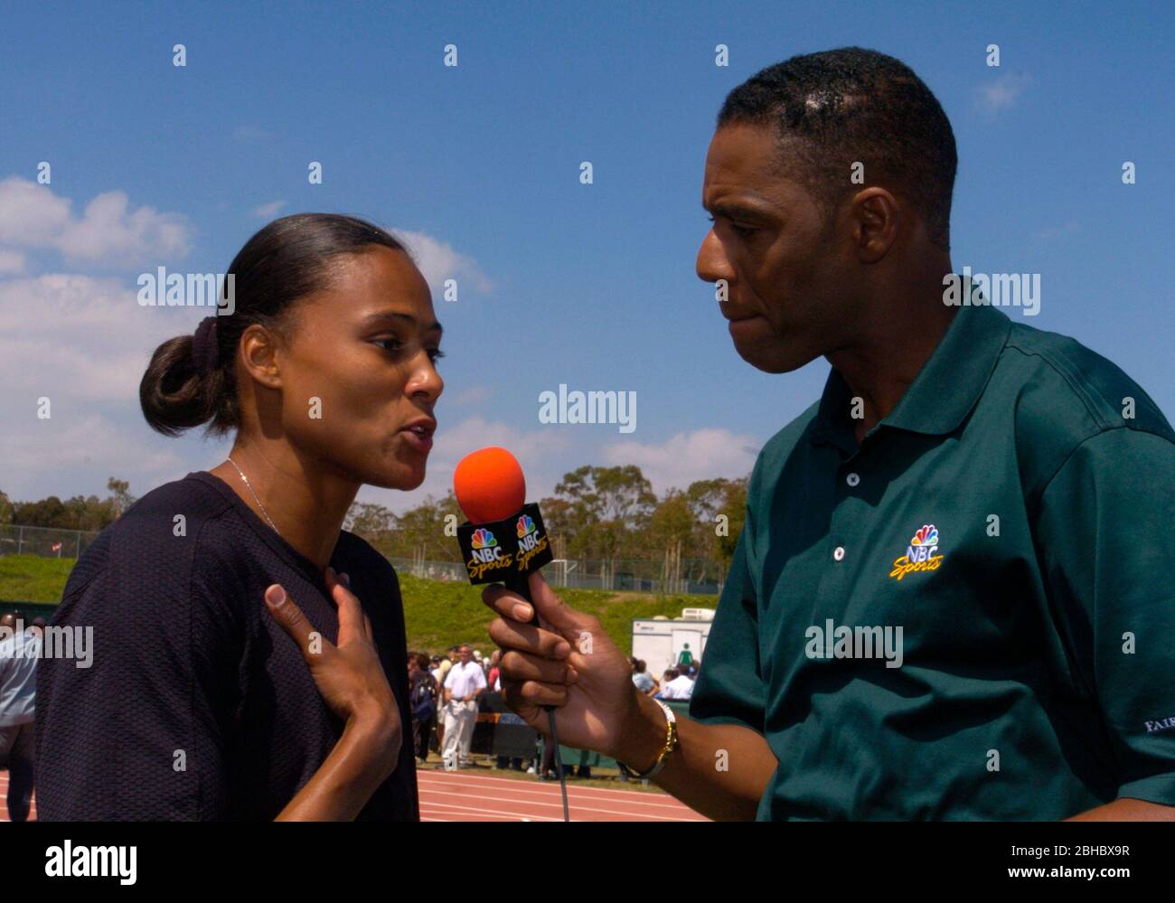 Carson, United States. 22nd May, 2004. Marion Jones is interviewed by Lewis Johnson of NBC Sports during the Home Depot Track & Field Invitational at the Home Depot Center, Saturday, May 22, 2004, in Carson, Calif. Photo via Credit: Newscom/Alamy Live News Stock Photo