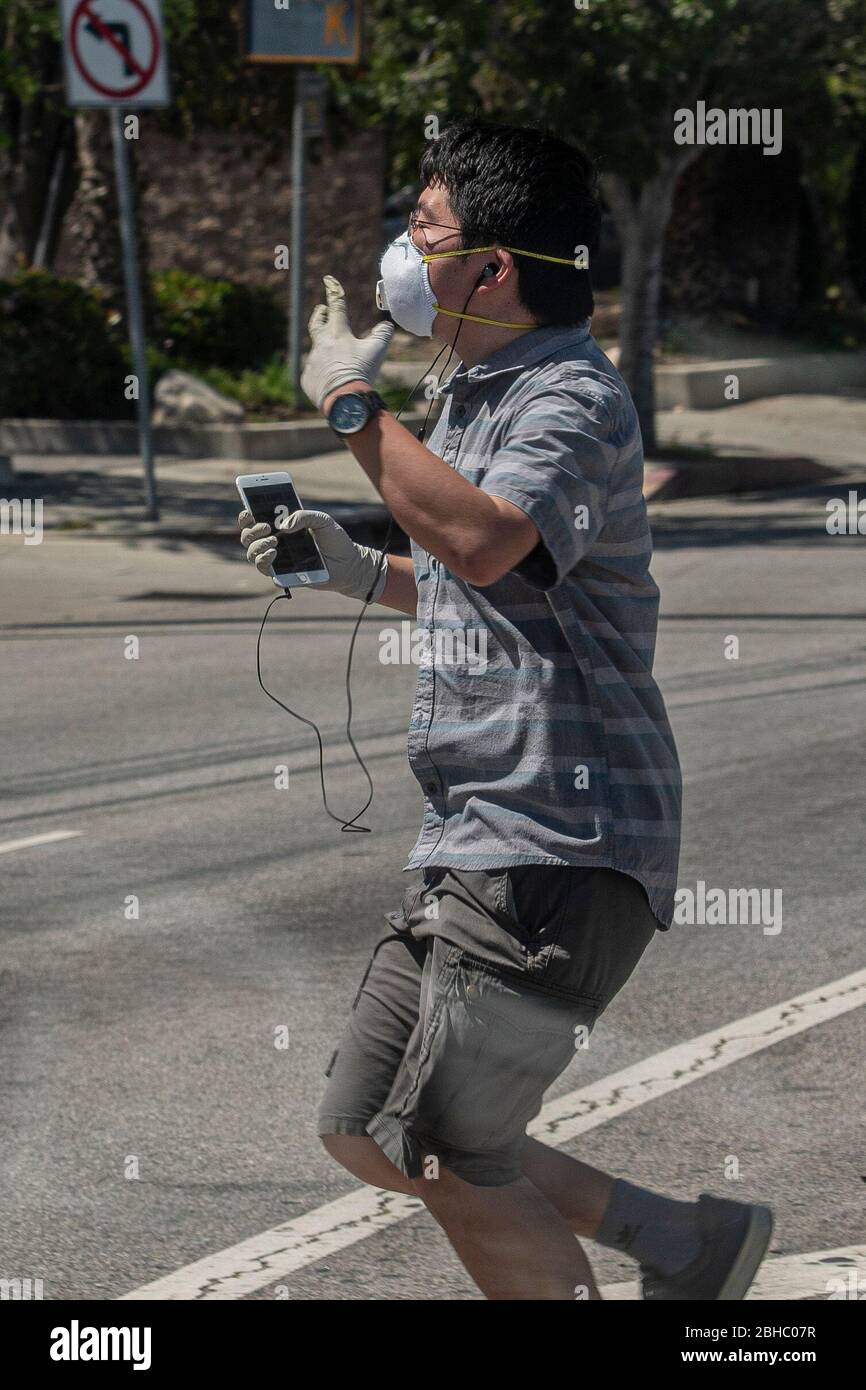Los Angeles, California, USA. 24th Apr, 2020. A man dances across a crosswalk while going about daily life under COVID-19 restrictions in Los Angeles, California, on Friday, April 24. Photo by Justin L. Stewart Credit: Justin L. Stewart/ZUMA Wire/Alamy Live News Stock Photo