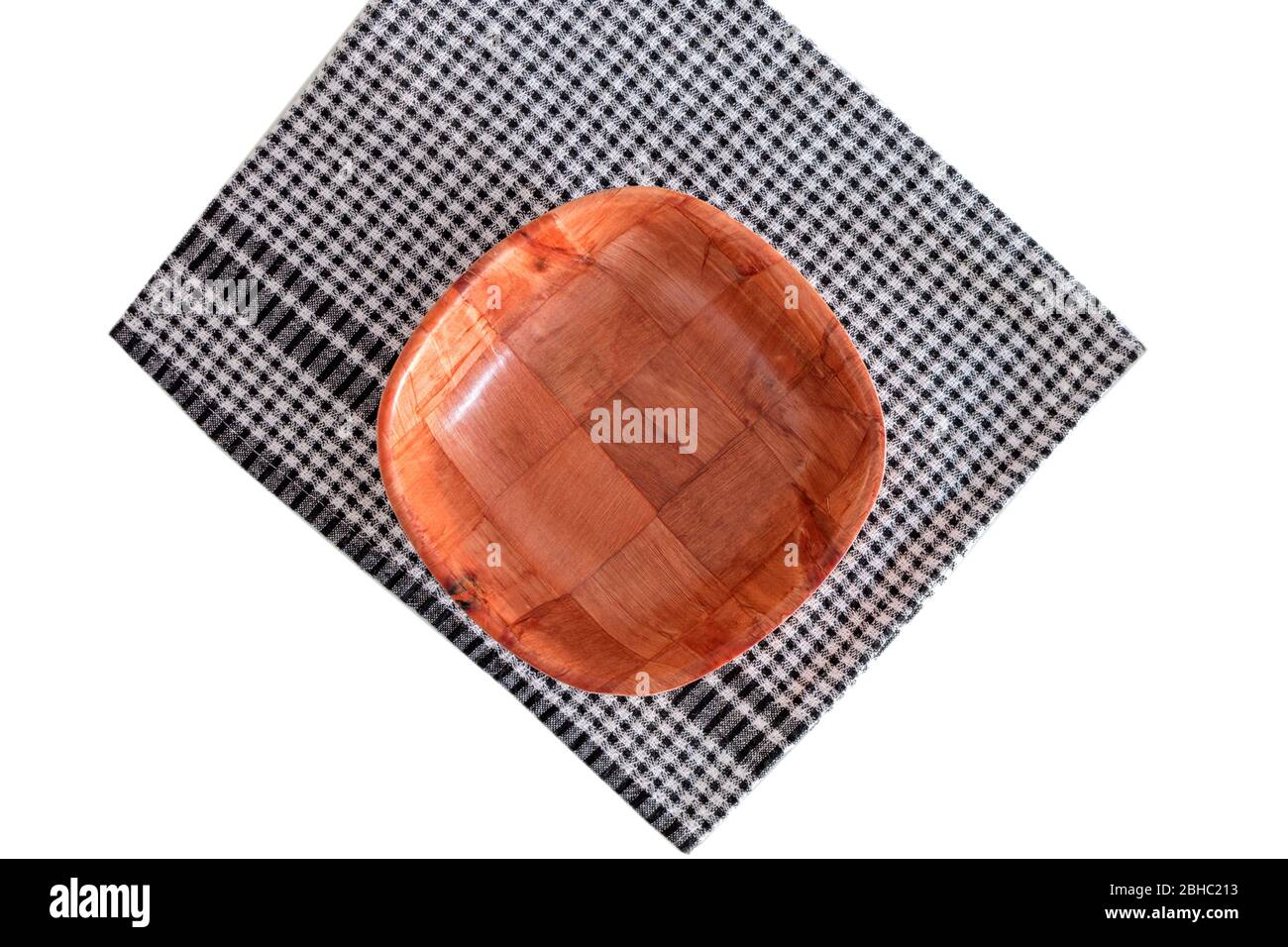 Empty bread basket on a kitchen towel. Photo with copy space. Stock Photo