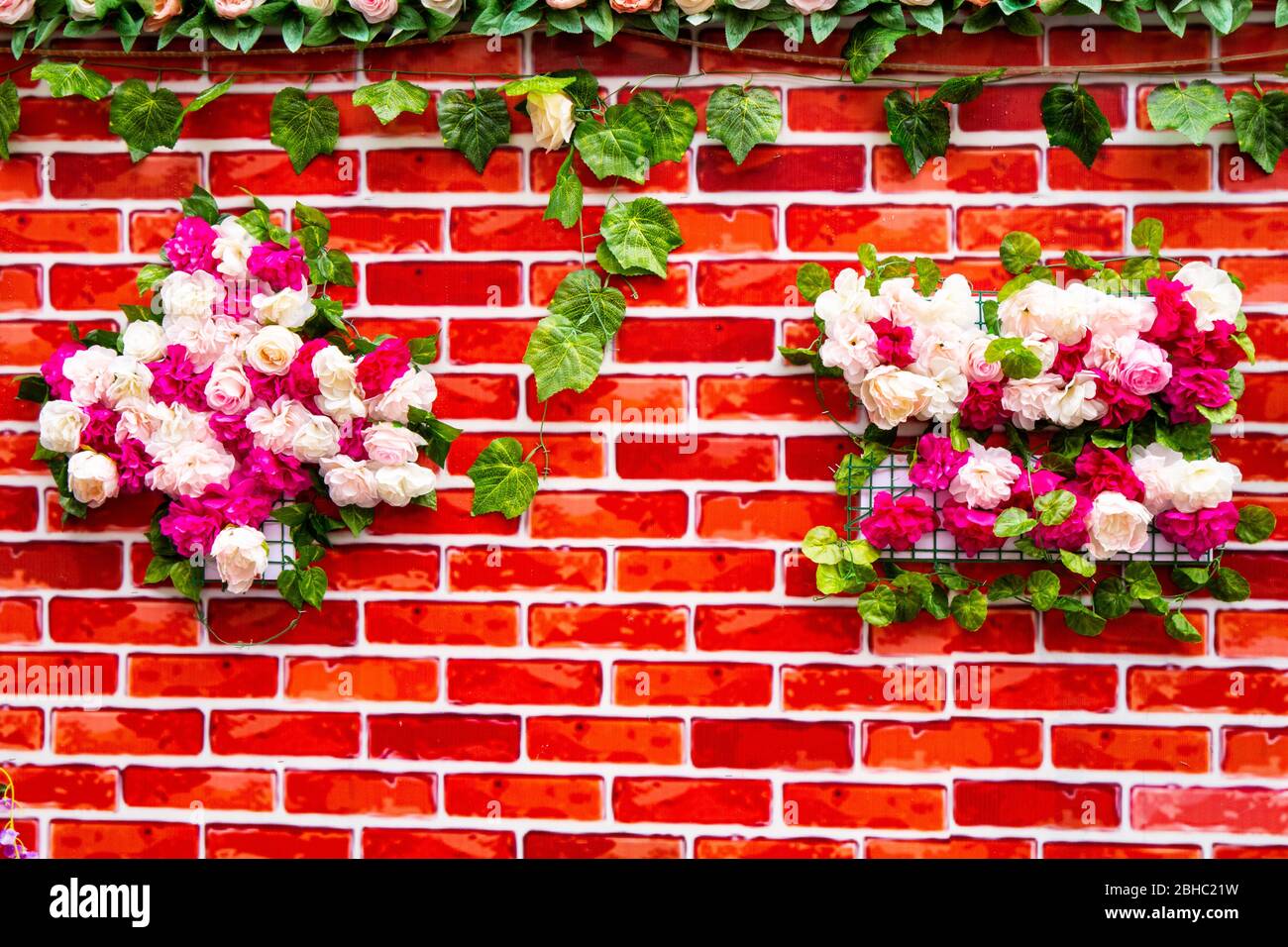 Flowers on the wall Stock Photo Alamy