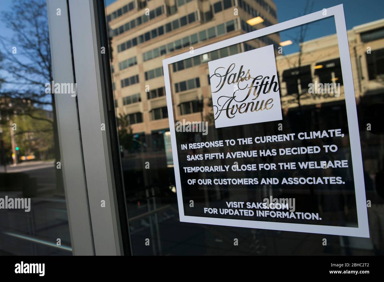 A sign informing customers a Saks Fifth Avenue retail store is closed