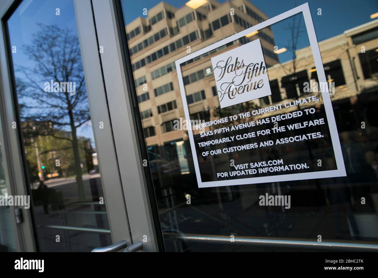A sign informing customers a Saks Fifth Avenue retail store is closed