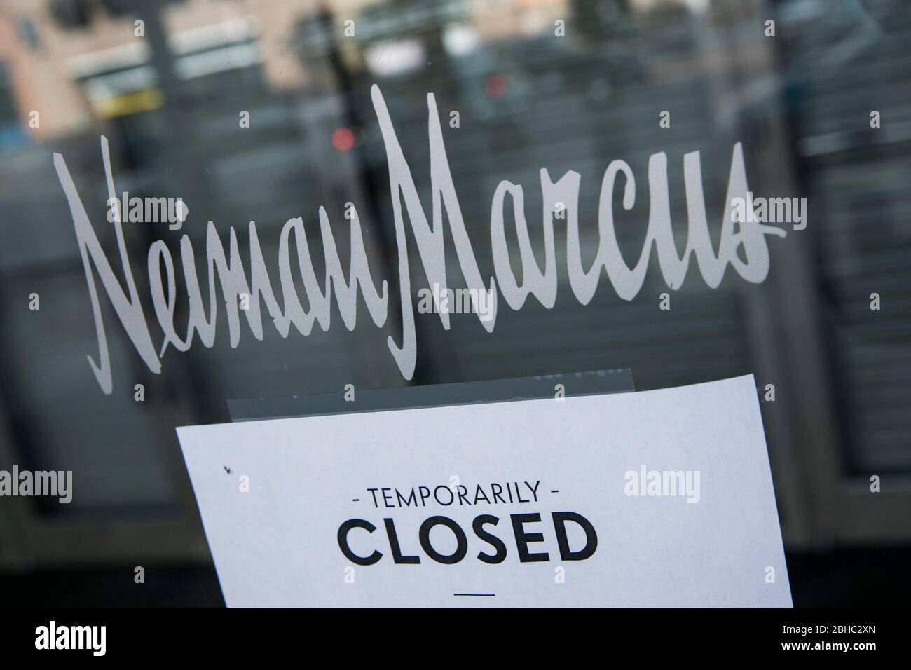 A sign informing customers a Neiman Marcus retail store is closed in