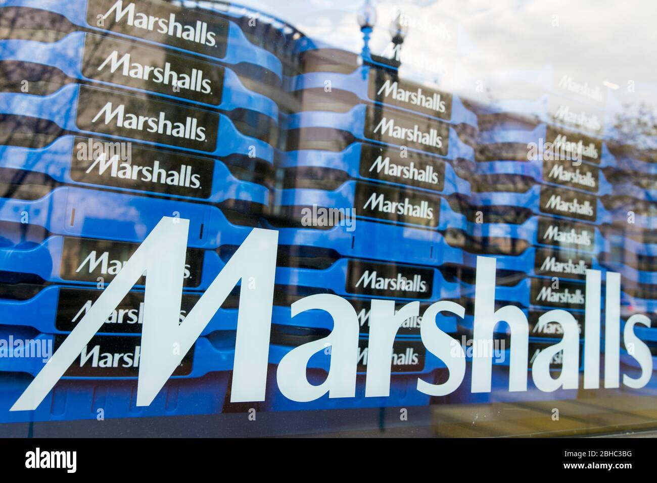 A logo sign outside of a Marshalls retail store location in Washington