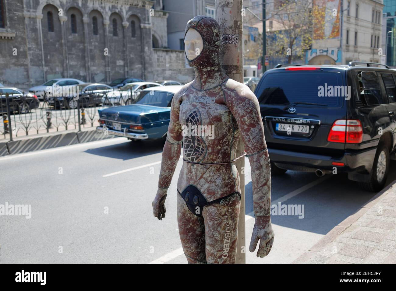 Dry camouflage  suit for recreational water sports, activities on a mannequin on the street. Stock Photo