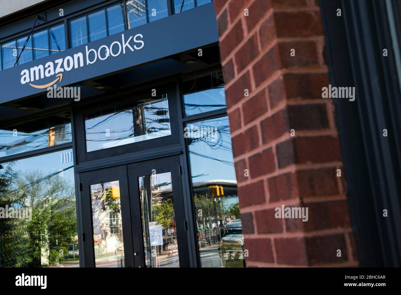 A logo sign outside of a Amazon Books retail store location in Bethesda
