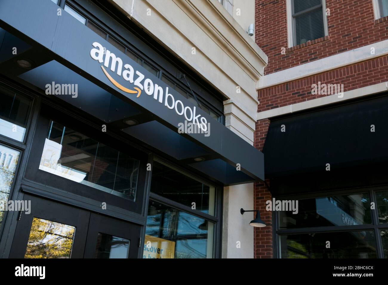 A logo sign outside of a Amazon Books retail store location in Bethesda