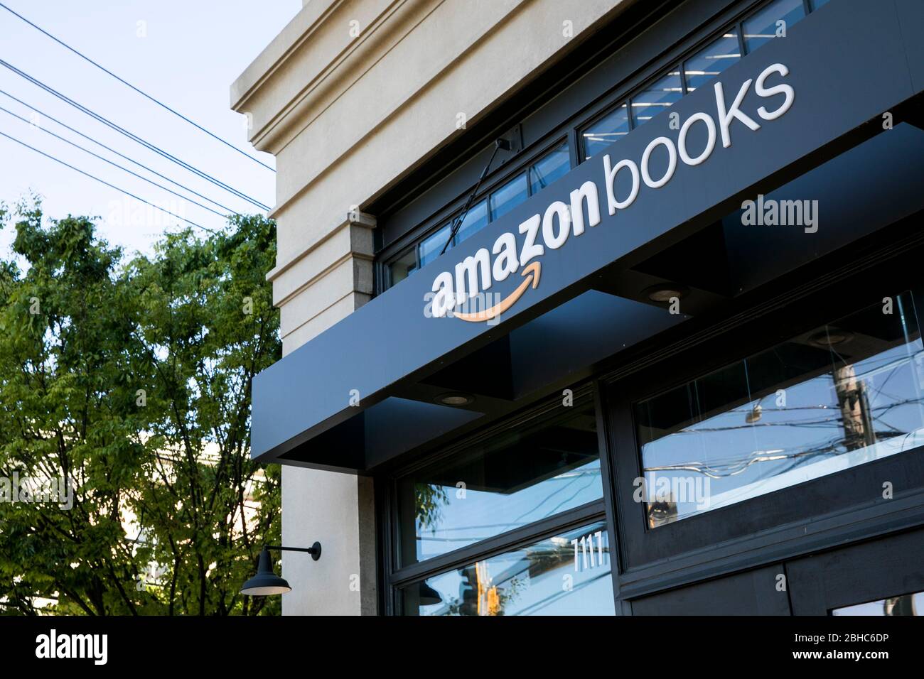 A logo sign outside of a Amazon Books retail store location in Bethesda
