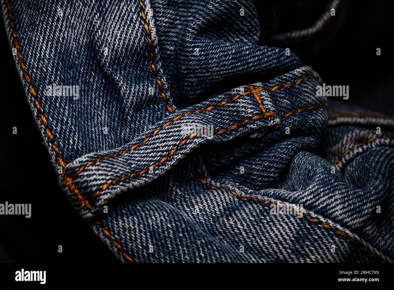 A close-up picture of crinkle blue jeans Stock Photo - Alamy