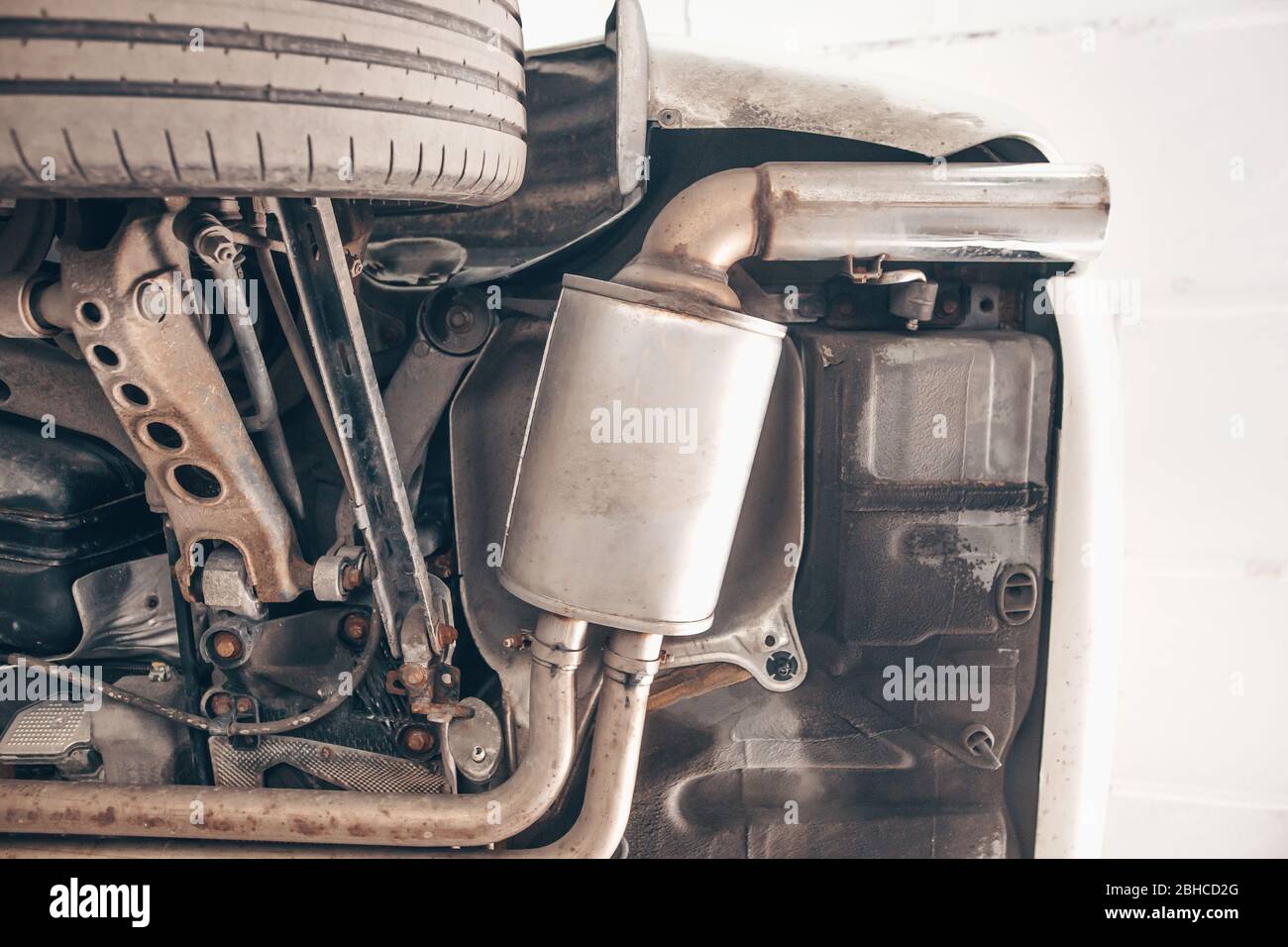 Close up of car exhaust system pipe at the garage, automotive car