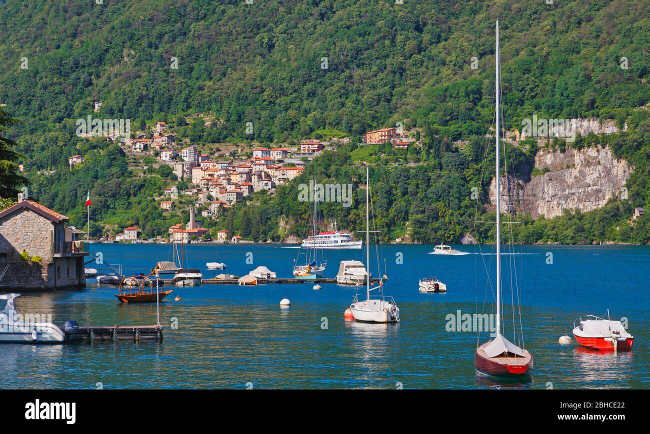 Pognana Lario on Lake Como, Como Province, Lombardy, Italy.  Ferry boat in distance. Stock Photo