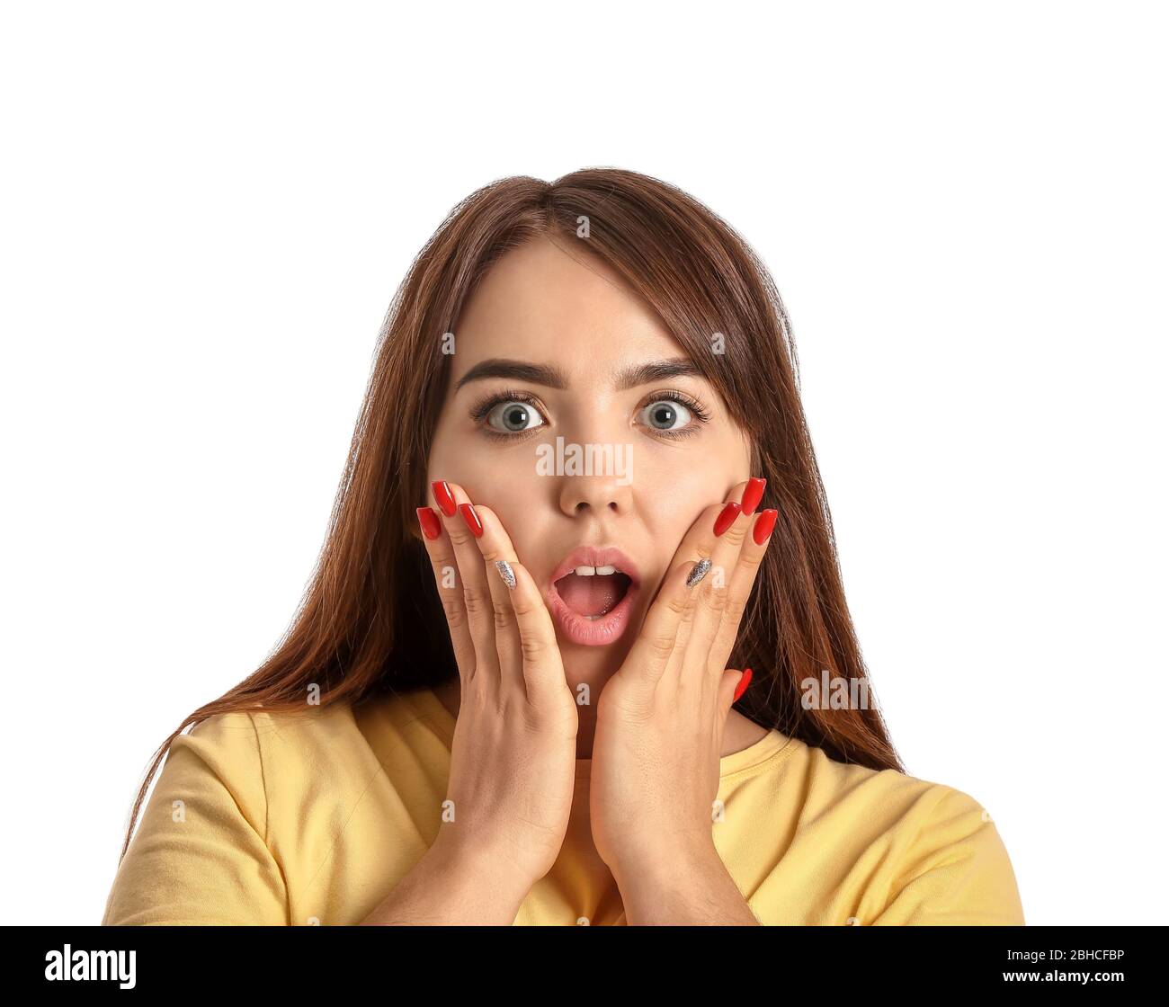Portrait of surprised young woman on white background Stock Photo - Alamy