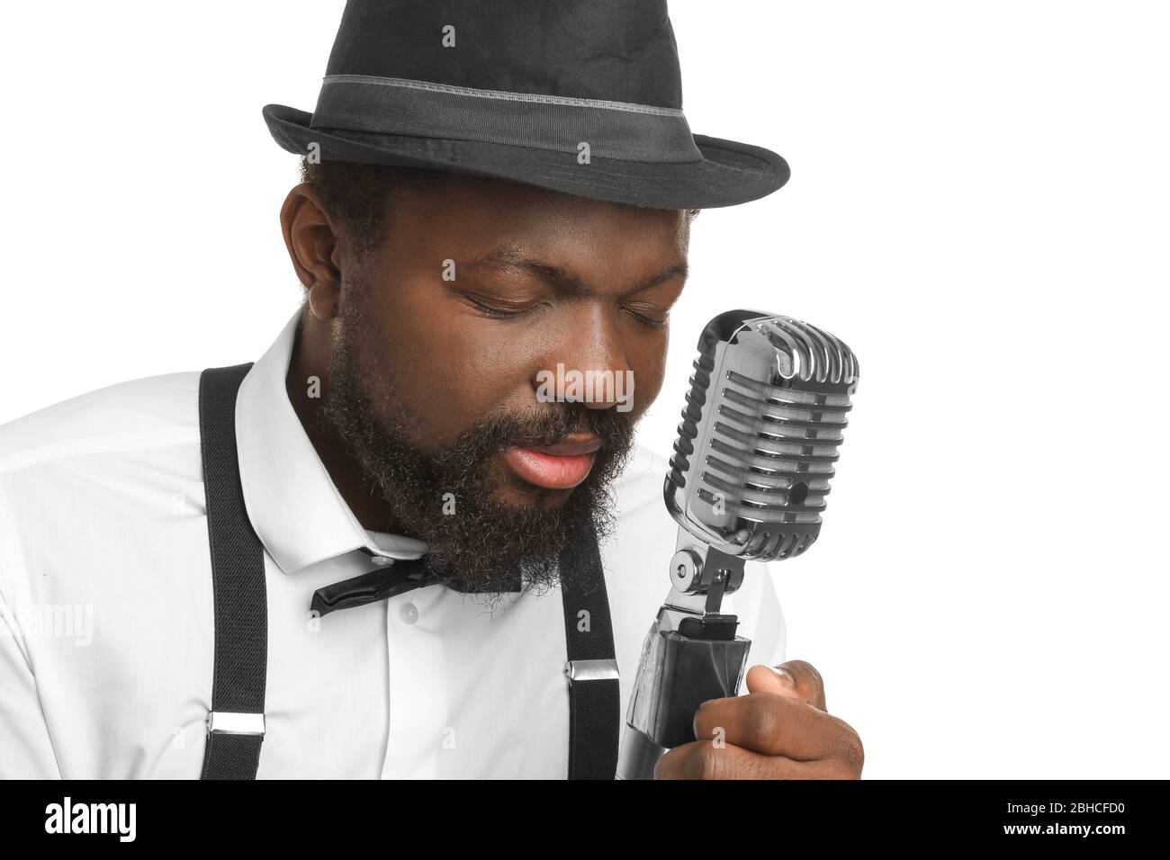 Male African-American singer on white background Stock Photo