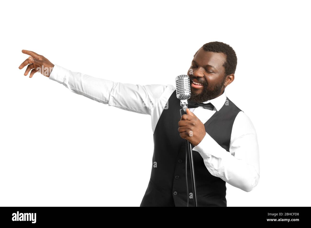 Male African-American singer on white background Stock Photo