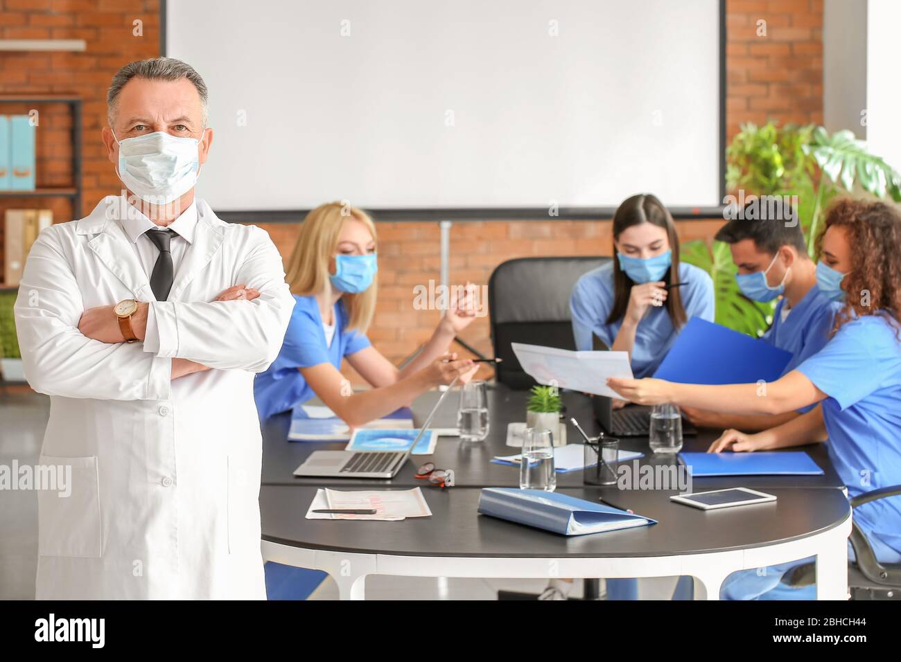 Male lecturer with medical students in university Stock Photo