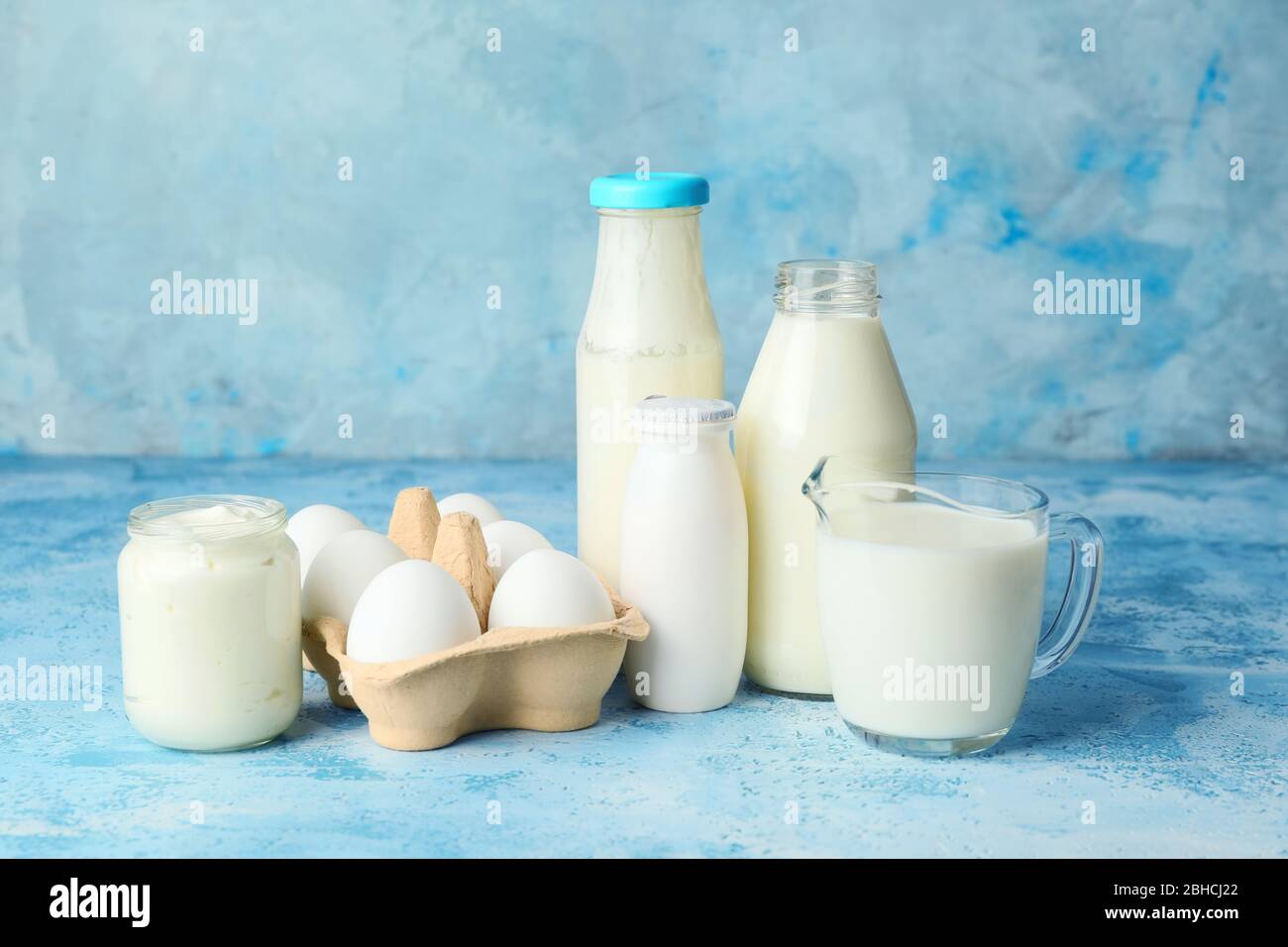 Different dairy products on color background Stock Photo - Alamy