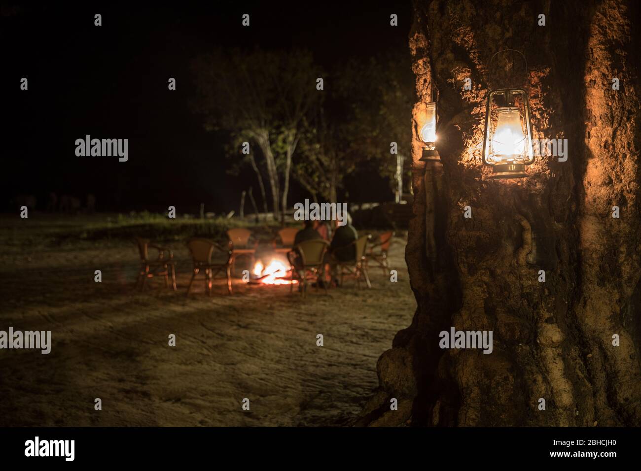 Campfires and kerosene lanters provide a classic safari feel to camps in Hwange National Park, Matabeleland North Province, Zimbabwe. Stock Photo
