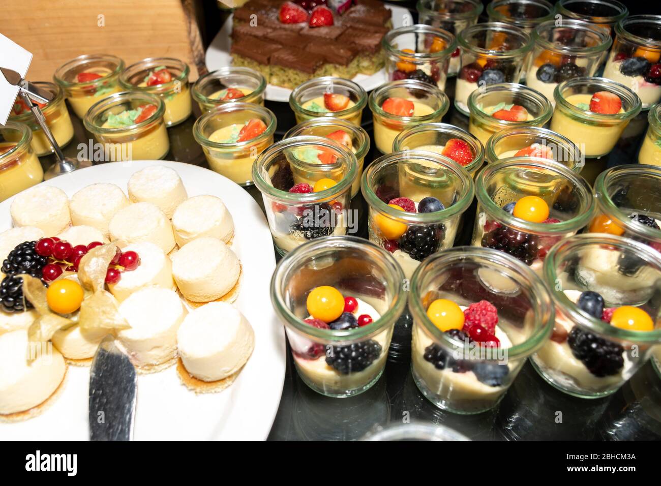 Dessert buffet or candy bar during catering event. Many different sweets  closeup: cookies, pastry, bakery, tart, cake, muffins, cups, lemon, vanilla  Stock Photo - Alamy