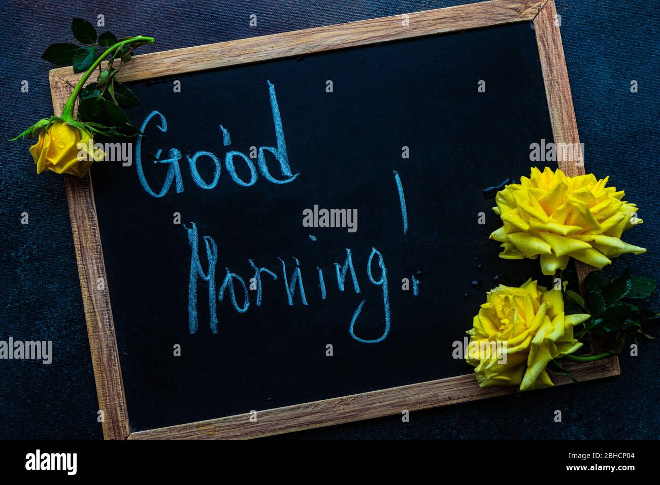 Good morning concept on chalkbard and yellow roses Stock Photo - Alamy