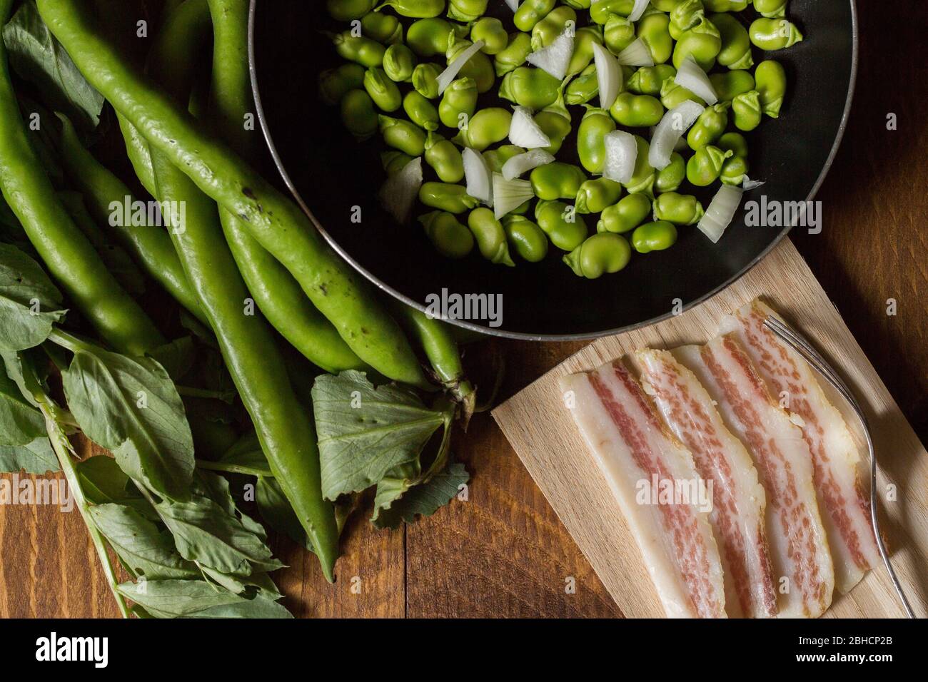 Fresh fava bean with bacon. The broad bean is a species of flowering