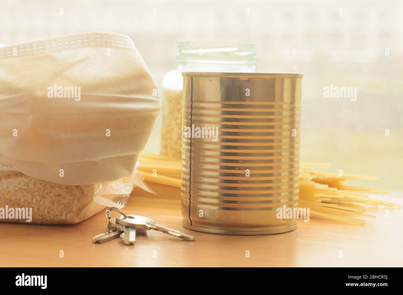 Coronavirus food.Foods for quarantine on wooden background by the window. Stock Photo
