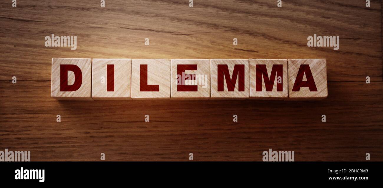 DILEMMA word made with building blocks. Choice from two alternatives