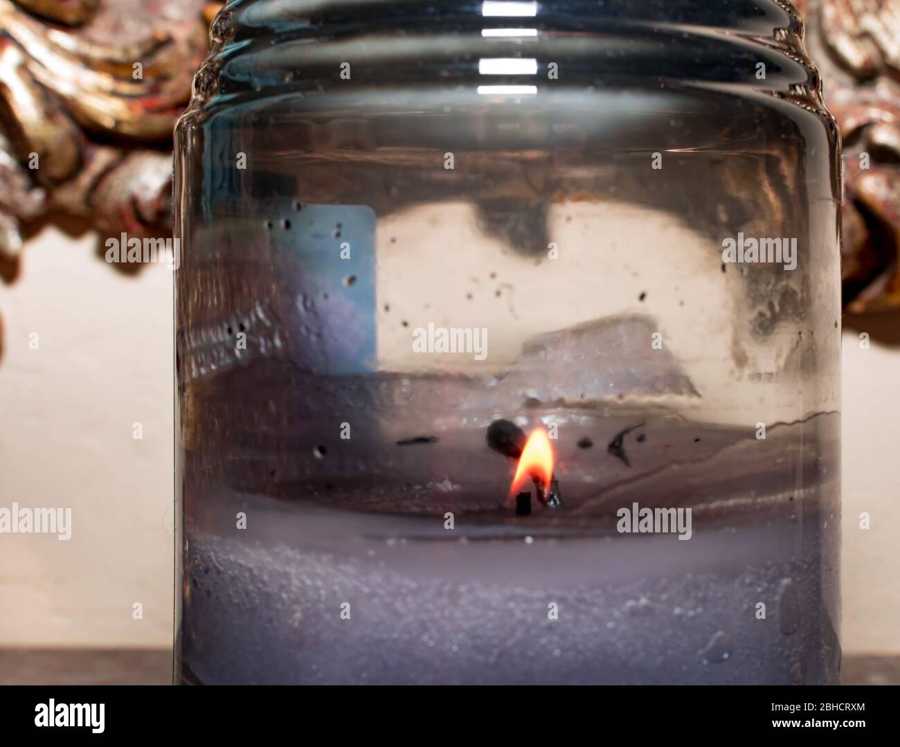 Candle burning inside a small jar. A jar with burning candle inside Stock Photo Alamy