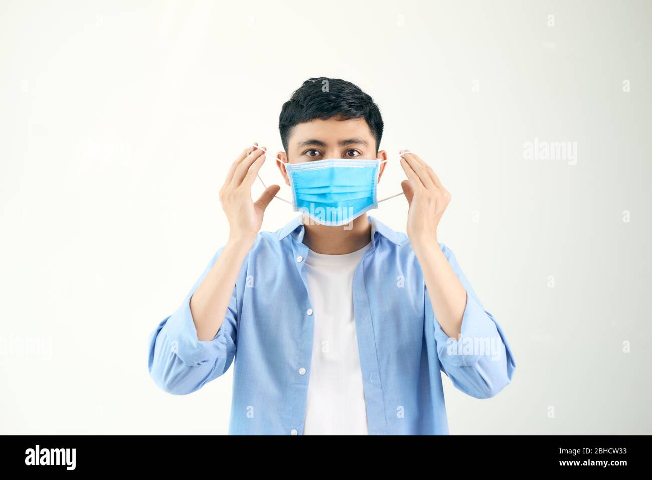 Man wearing an anti virus protection mask to prevent others from corona COVID-19 and SARS cov 2 infection Stock Photo