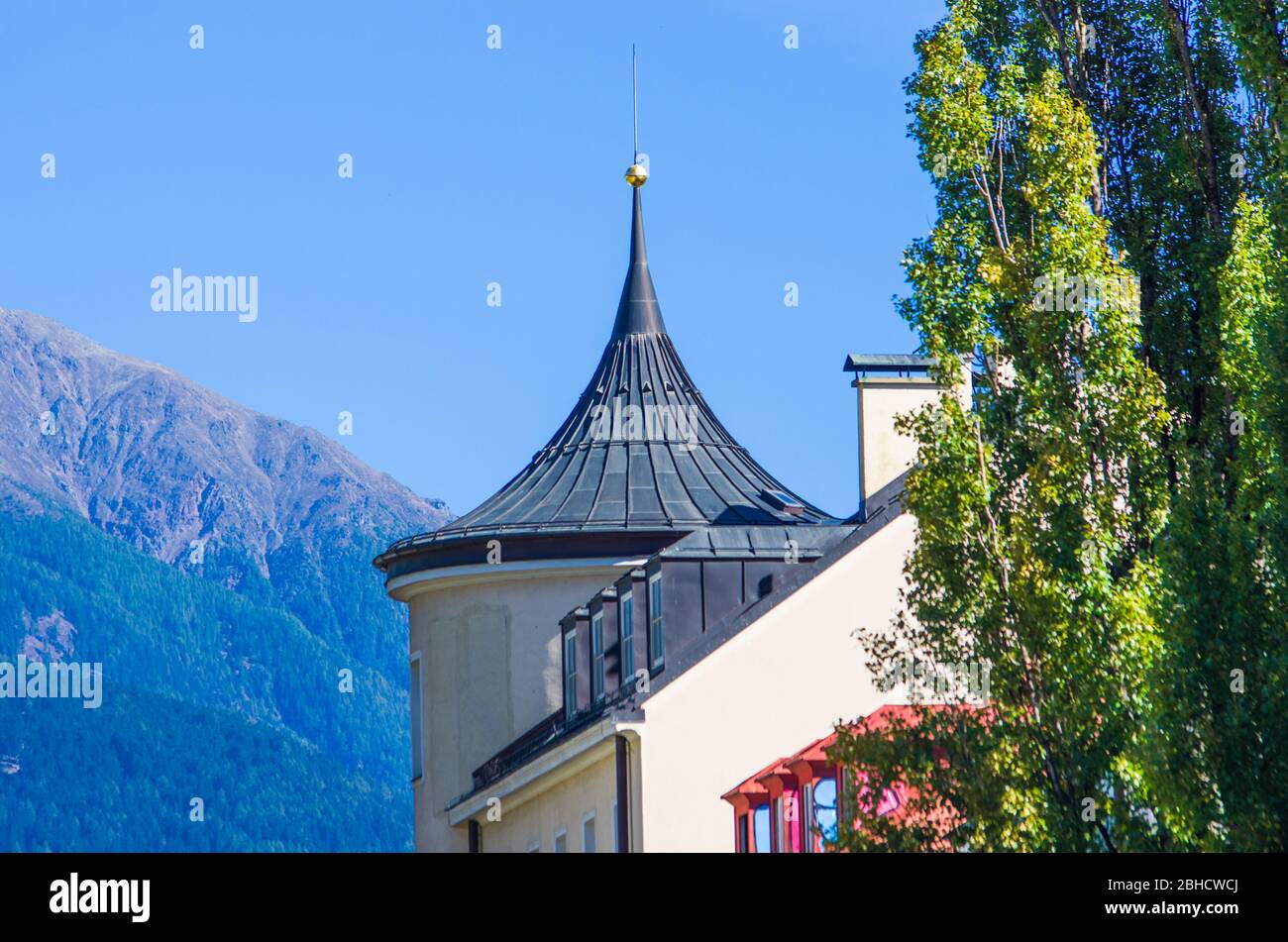 church with onion bell tower in the mountains in the Gothic style with ...
