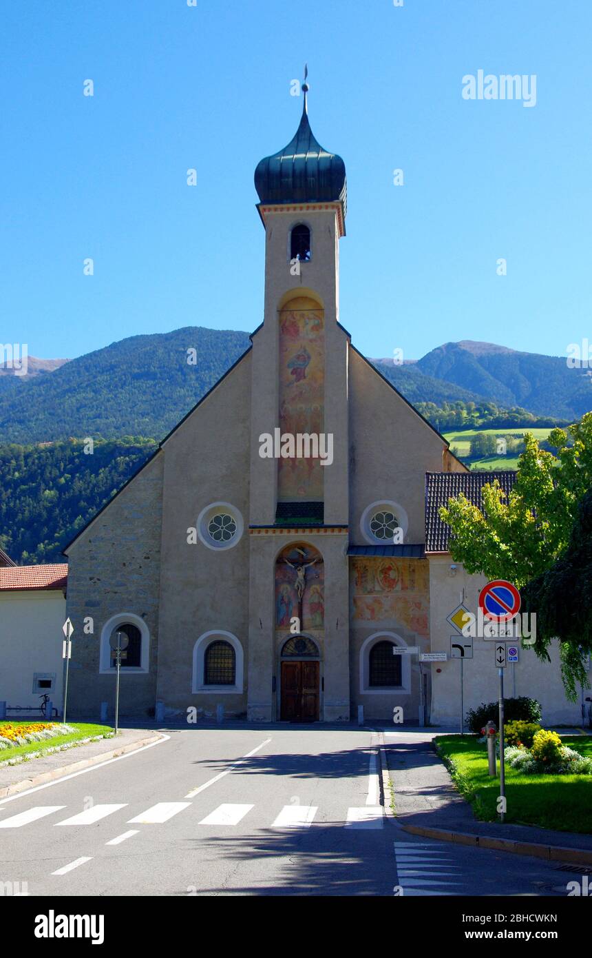 church with onion bell tower in the mountains in the Gothic style with ...