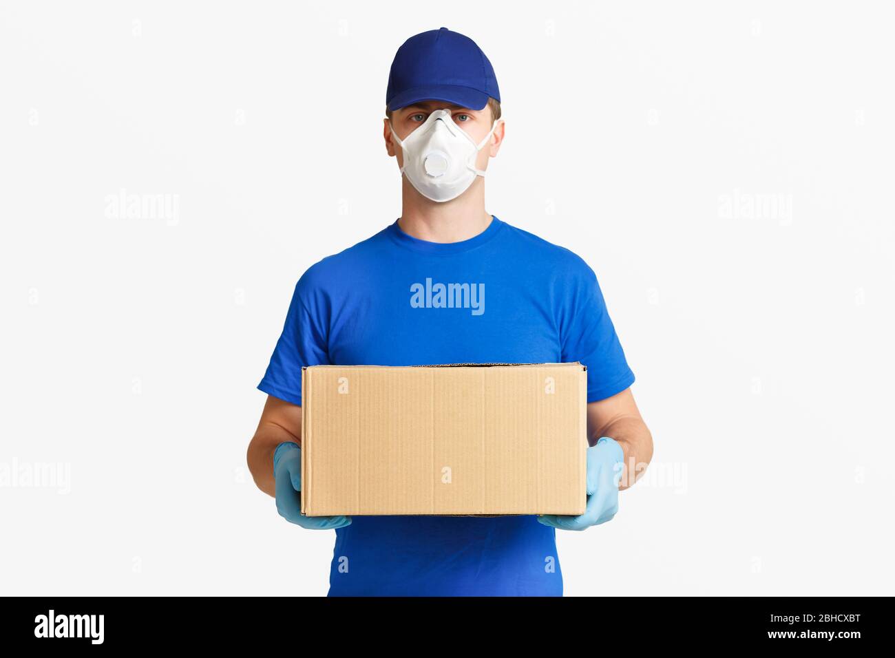 Fast delivery parcels. Courier in blue uniform Stock Photo