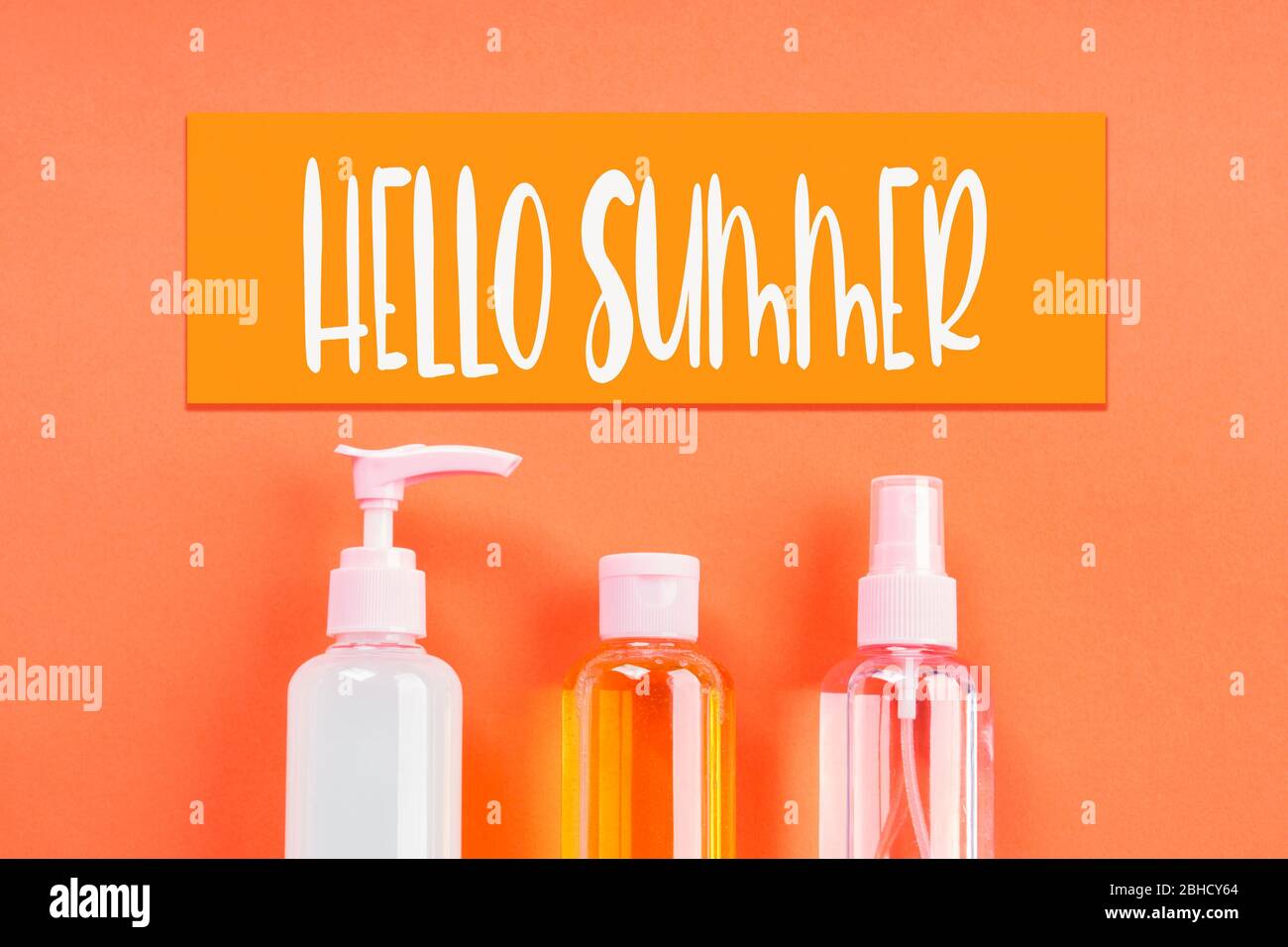 Generic beauty products on orange. Hello summer Stock Photo