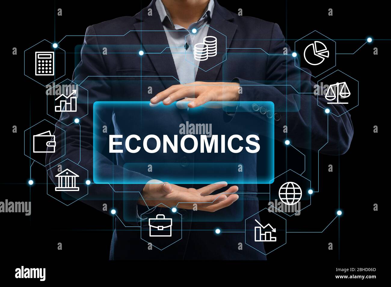 Man in suit holds abstract inscription economics Stock Photo - Alamy Man in suit holds abstract inscription economics Stock Photo - Alamy