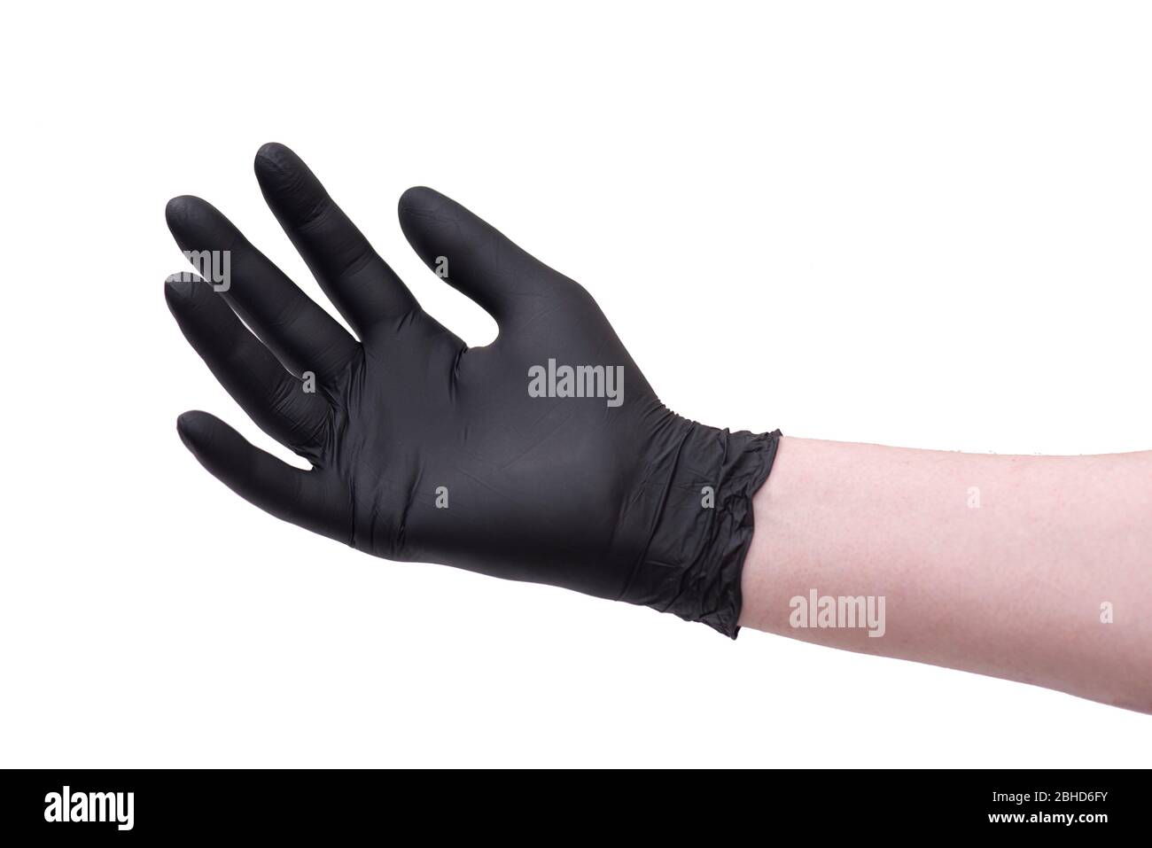 Hand in black latex glove isolated on white background Stock Photo
