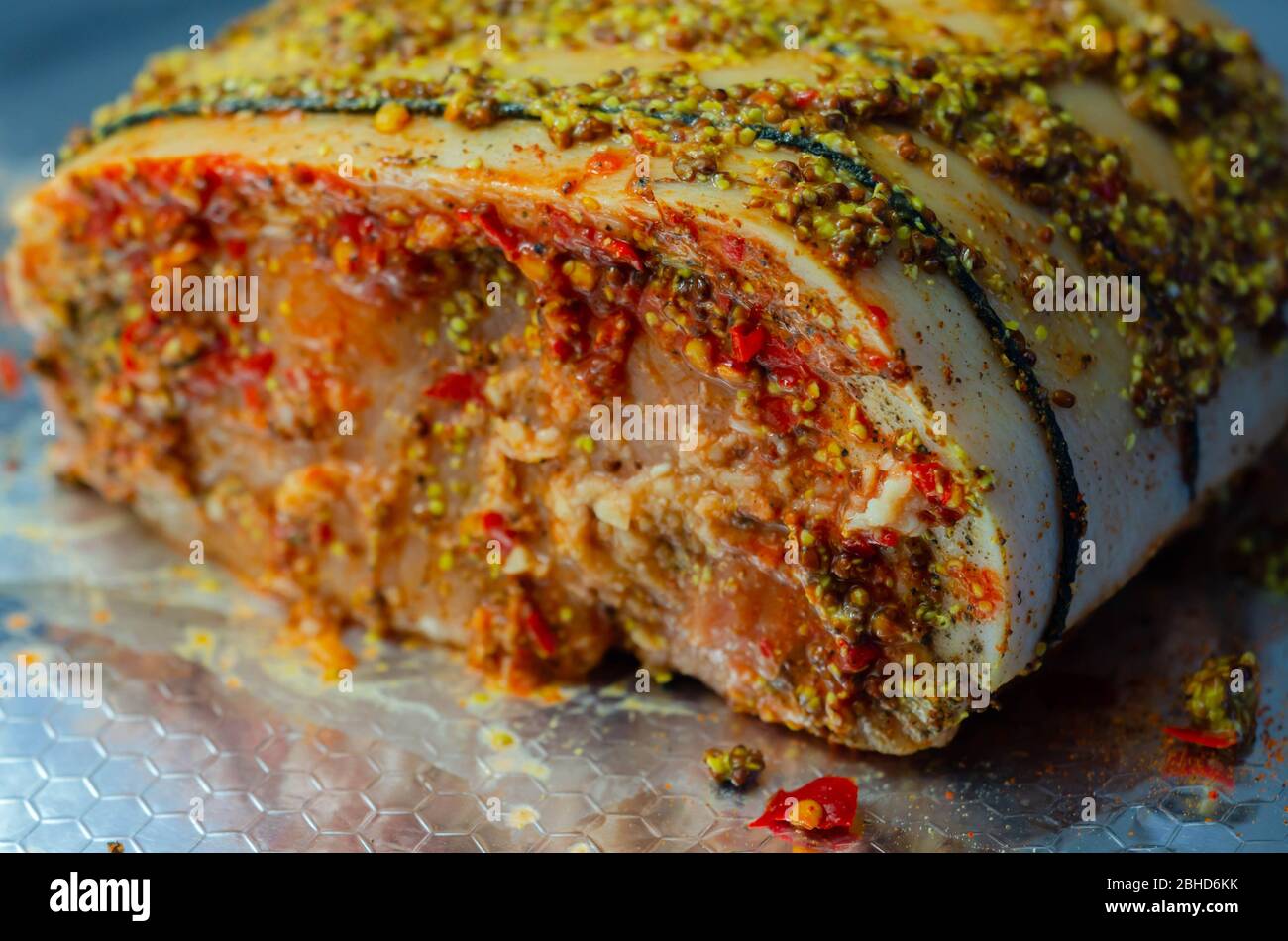 Boneless British rindon pork loin joint, prepared in marinades